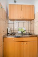 Kuchyň nebo kuchyňský kout v ubytování Apartments Antonija
