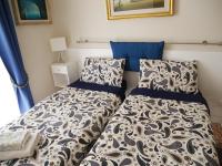A bed or beds in a room at Nori Guest House
