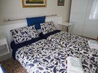 A bed or beds in a room at Nori Guest House