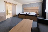 Postel nebo postele na pokoji v ubytování Hotel Zebetinsky Dvur Brno