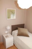 A bed or beds in a room at 1ªLinea de playa Puerto de Sagunto