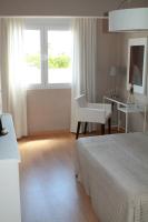 A bed or beds in a room at 1ªLinea de playa Puerto de Sagunto