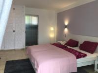 A bed or beds in a room at La Palmita
