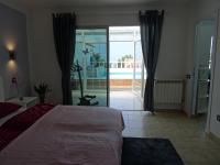 A bed or beds in a room at La Palmita