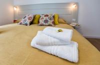 A bed or beds in a room at Jolie Julie Accomodation