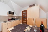 Kuchyňa alebo kuchynka v ubytovaní Apartamenty Sun & Snow Kościelisko Residence
