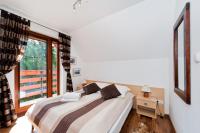 Posteľ alebo postele v izbe v ubytovaní Apartamenty Sun & Snow Kościelisko Residence
