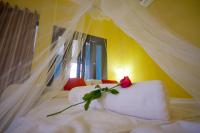 Postel nebo postele na pokoji v ubytování Laemsing Whitehouse Resort