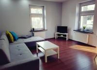 Televízia a/alebo spoločenská miestnosť v ubytovaní Apartament Szczawno-Zdrój