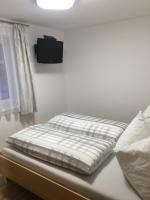 Łóżko lub łóżka w pokoju w obiekcie Ferienwohnung Imbach