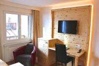 TV a/nebo společenská místnost v ubytování Hotel Conrad