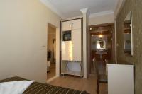 Postel nebo postele na pokoji v ubytování Soyic Hotel