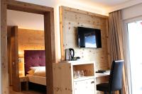 Postel nebo postele na pokoji v ubytování Hotel Conrad