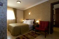 Postel nebo postele na pokoji v ubytování Soyic Hotel