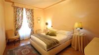 Posteľ alebo postele v izbe v ubytovaní Albergo Castiglione Langhe