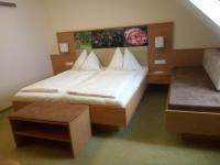 A bed or beds in a room at Hotel Restaurant zum Schwan