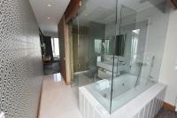 a bathroom with a tub and a glass shower at The Marmara Pera in Istanbul