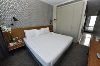 a bedroom with a large white bed in a room at The Marmara Pera in Istanbul