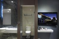 a bathroom with a toilet and a sink and a mirror at Beauty Hotels Taipei - Hotel B6 in Taipei