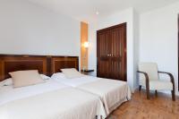 Postel nebo postele na pokoji v ubytování Hotel Don Curro