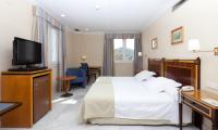 Postel nebo postele na pokoji v ubytování Hotel Don Curro
