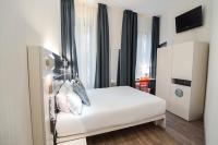 A bed or beds in a room at Petit Palace Canalejas Sevilla