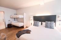 A bed or beds in a room at Petit Palace Canalejas Sevilla