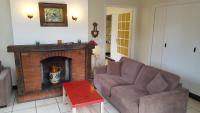 a living room with a couch and a fireplace at Moulin de Chappes in Chappes