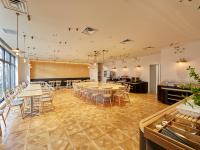 a large room with tables and chairs in it at Hearton Hotel Shinsaibashi Nagahoridouri in Osaka