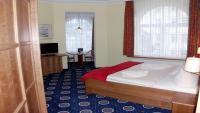 Postel nebo postele na pokoji v ubytování Hotel Deutsche Flagge