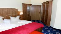 Postel nebo postele na pokoji v ubytování Hotel Deutsche Flagge