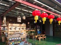 a store with red lanterns hanging from the ceiling at Taichung Xinshe Garden Life Homestay B&amp;B in Xinshe