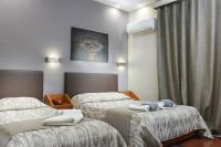 Posteľ alebo postele v izbe v ubytovaní Hotel Lithaion