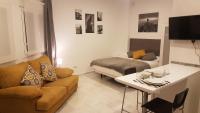 Televízia a/alebo spoločenská miestnosť v ubytovaní Alcazaba Home City Centre