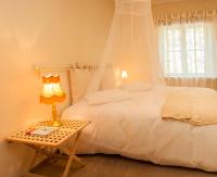 Postel nebo postele na pokoji v ubytování Kuursaal Guesthouse