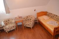 Postel nebo postele na pokoji v ubytování Hotel Tři Věžičky
