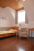 Postel nebo postele na pokoji v ubytování Hotel Tři Věžičky