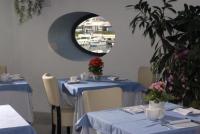 Un restaurante o sitio para comer en Hotel Villa Carolina