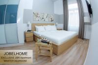 A bed or beds in a room at JobelHome