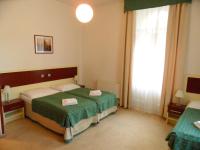 Postel nebo postele na pokoji v ubytování Hotel Atos