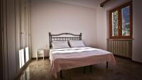 A bed or beds in a room at Casa della Vittoria