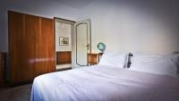 A bed or beds in a room at Casa della Vittoria