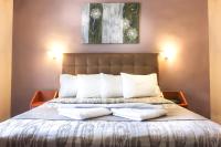 Posteľ alebo postele v izbe v ubytovaní Hotel Lithaion