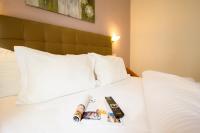 Posteľ alebo postele v izbe v ubytovaní Hotel Lithaion