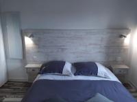 Cama ou camas em um quarto em Les Soleils de Pontaillac