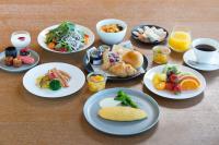 a table with plates of breakfast foods and drinks at The Prince Gallery Tokyo Kioicho, a Luxury Collection Hotel in Tokyo
