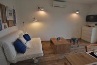 Televízia a/alebo spoločenská miestnosť v ubytovaní Apartment Christian