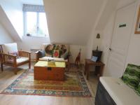 a living room with a couch and a coffee table at Vaintan B&amp;B in Dragey