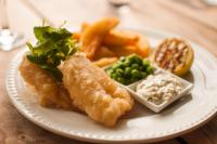 a plate of food with fish and chips and dip at The Manor Hotel in Crickhowell