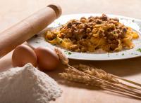 a plate of food on a table with eggs and oats at Hotel Felix in Rimini